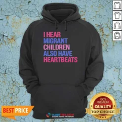 Official I Hear Migrant Children Also Have Heartbeats Bold Statement Text Hoodie in a comfortable pullover style with front pocket